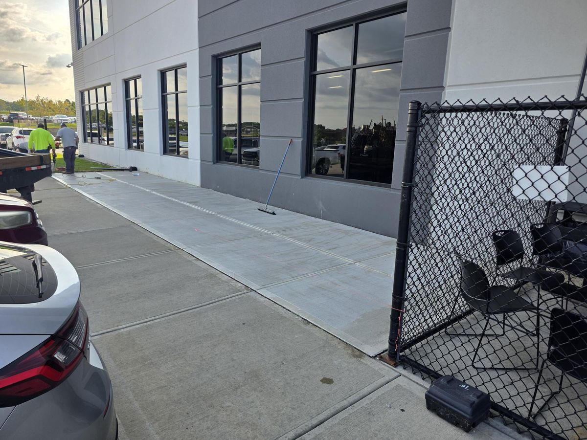 Concrete patio extension and fencing at the Dollar General distribution center in Walton, Kentucky